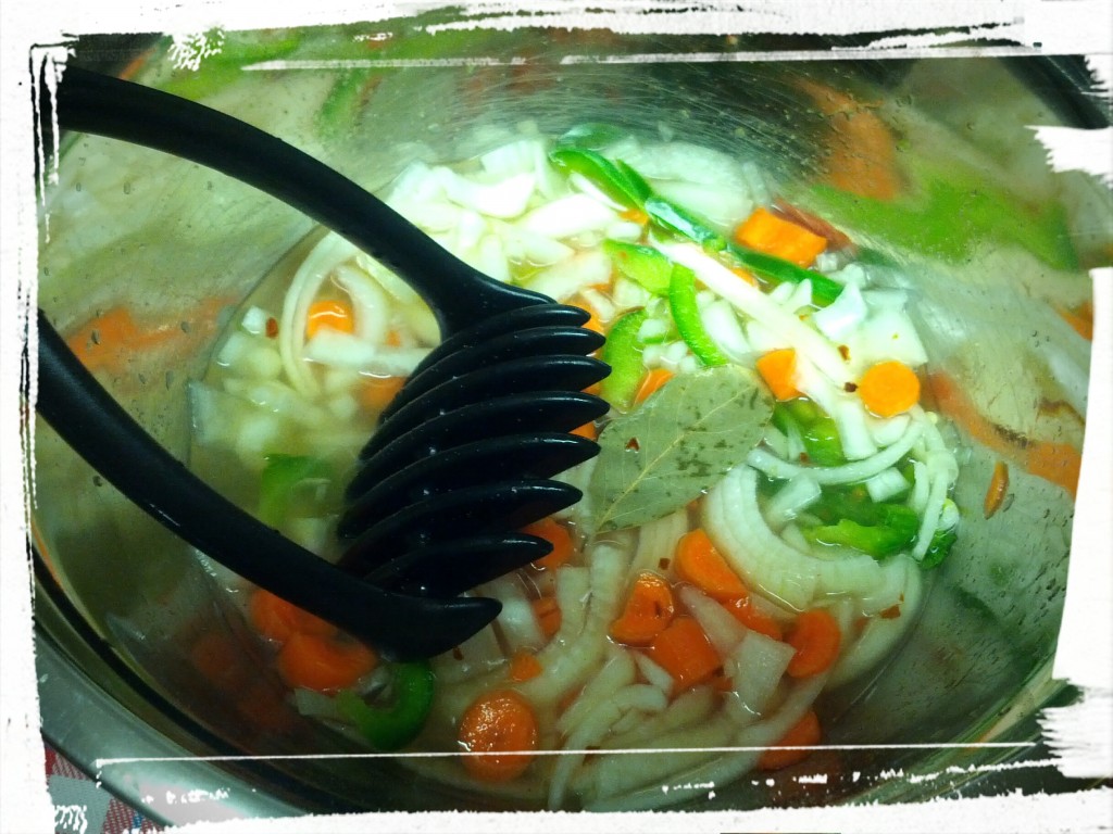 Stirring the veggies with the pickling juice. 