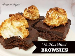 Brownies topped with fudge topped with a coconut macaroon.
