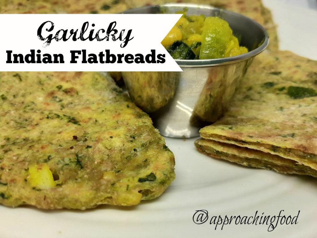 Flaky Indian flatbreads, served with dal for dipping. 